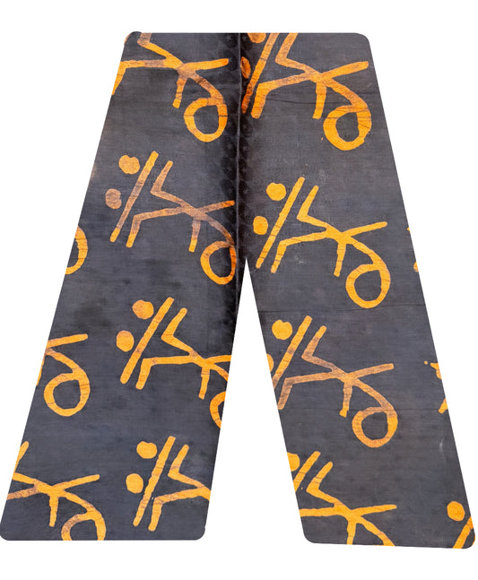 This is our traditional trousers. It is made from cotton.  The pattern is a stick man on a skate board in the colour orange on a black background