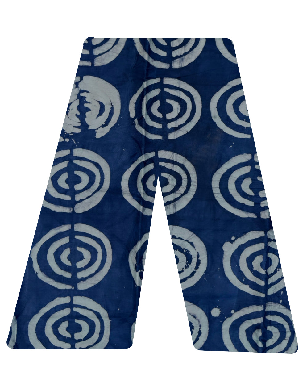 This is our traditional trousers. It is made from cotton. The pattern are multiple half circles in white on a navy blue background.