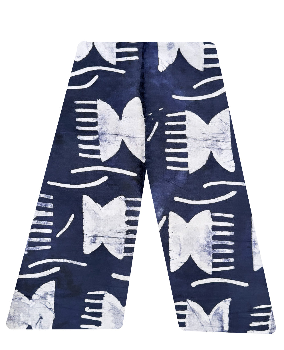 This is our traditional trousers. It is made from cotton. The patterns are combs and strands of hair which is in colour white and the background is Navy blue.